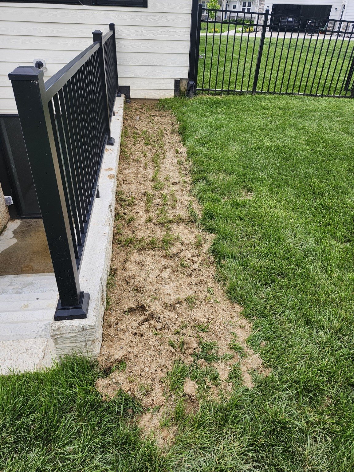 Rail-Side Mulch Refresh — before