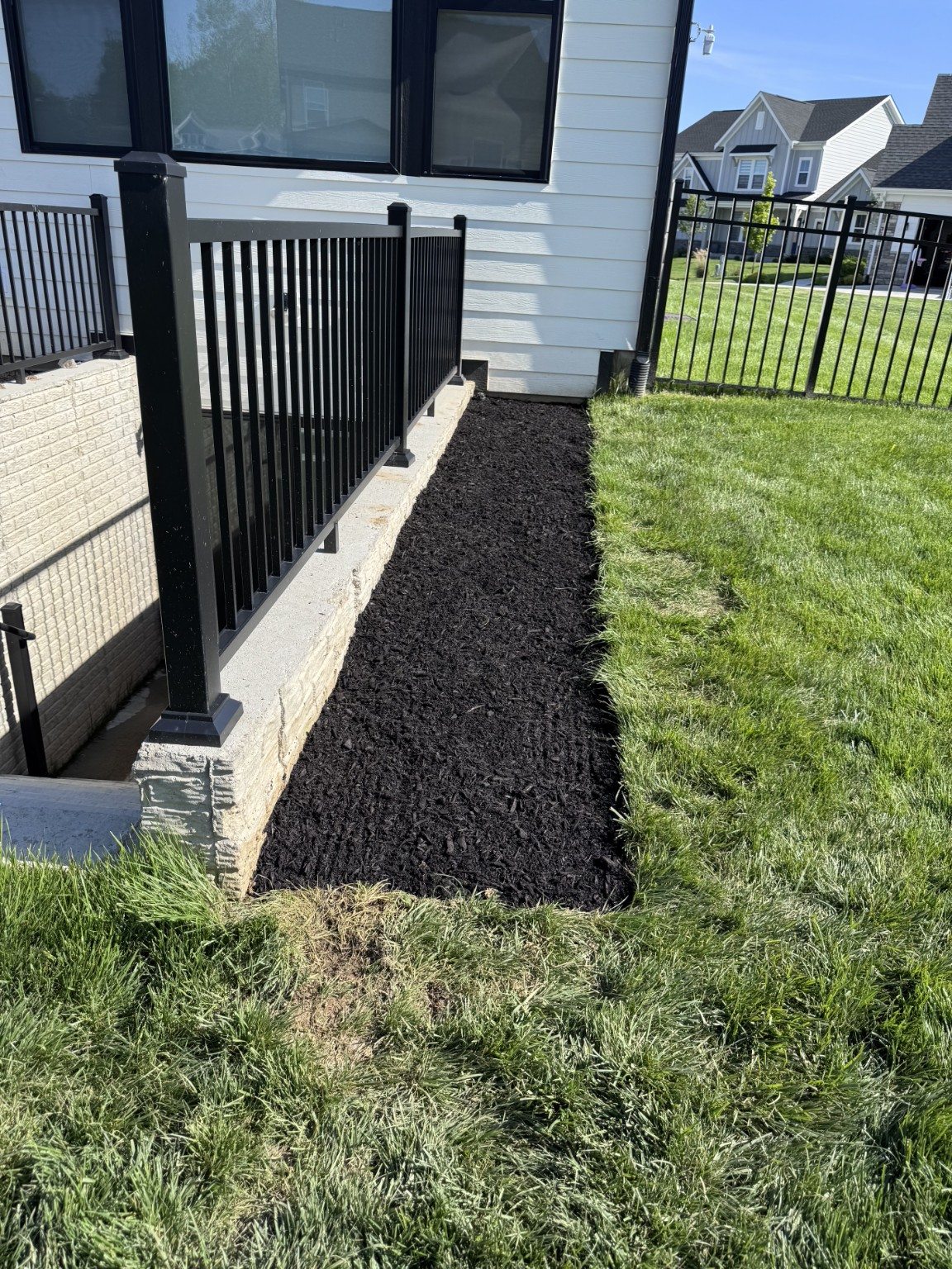 Rail-Side Mulch Refresh — after